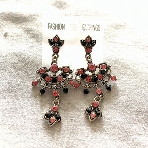 Beautiful pink and black stone earrings on metal base
